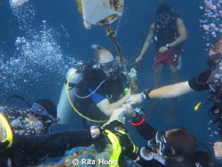 Everyone is holding on for decompression after a deep div... by Rita Hung 